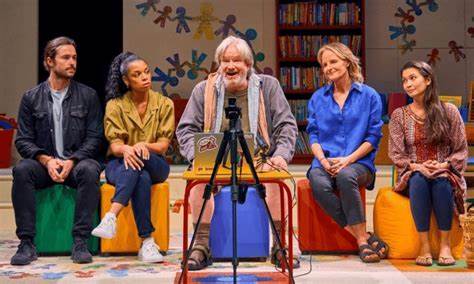 5 actors seated on stage