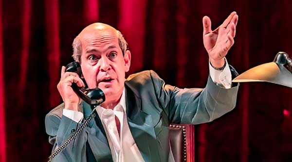 actor on the phone and gesticulating